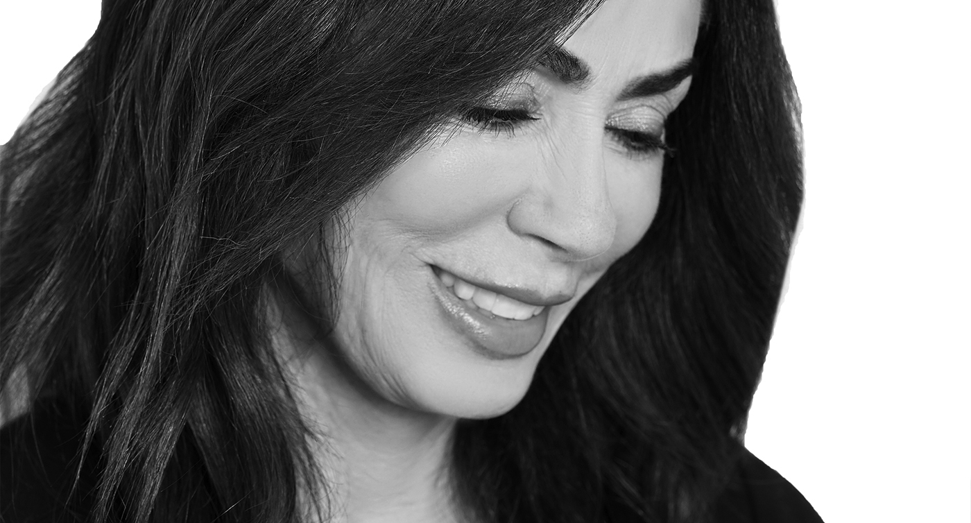 Black and white close up of Houston Texas dentist Terri Alani D D S looking down